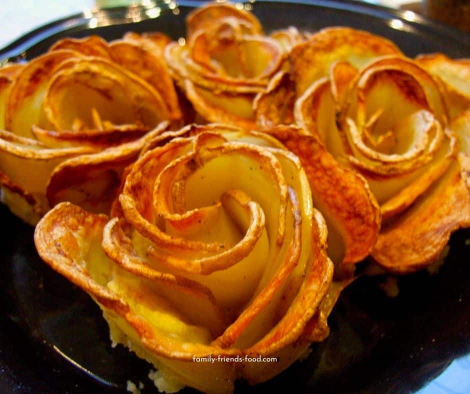 crispy potato roses on a plate.