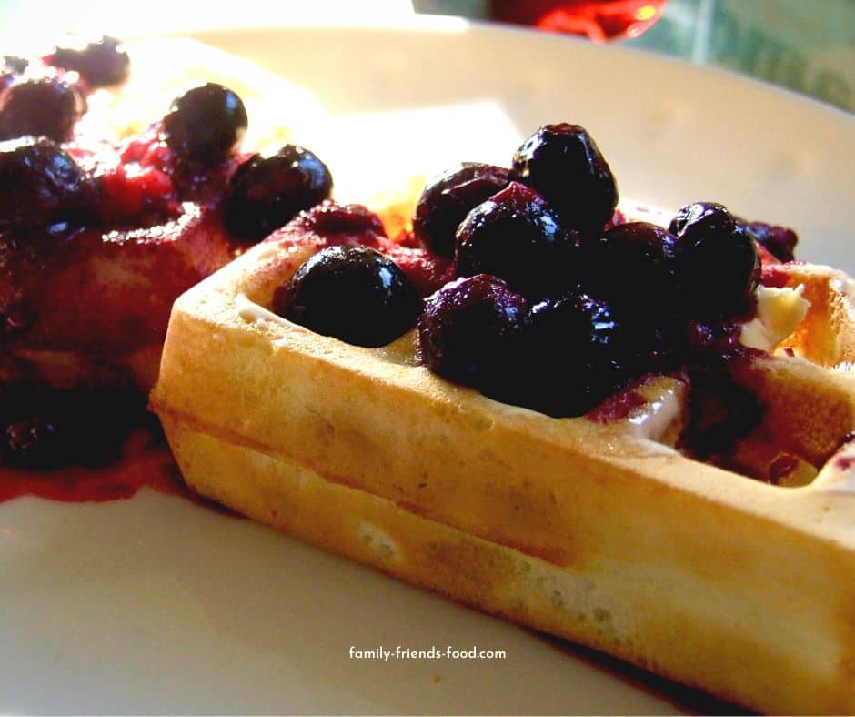 Waffles topped with berry compote.