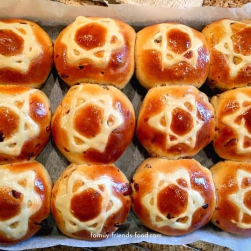 Rich, fruity, spicy & delicious, each of these buns sports a magnificent Magen David on its golden, shiny top. Enjoy them warm, cold or toasted. (Parve)