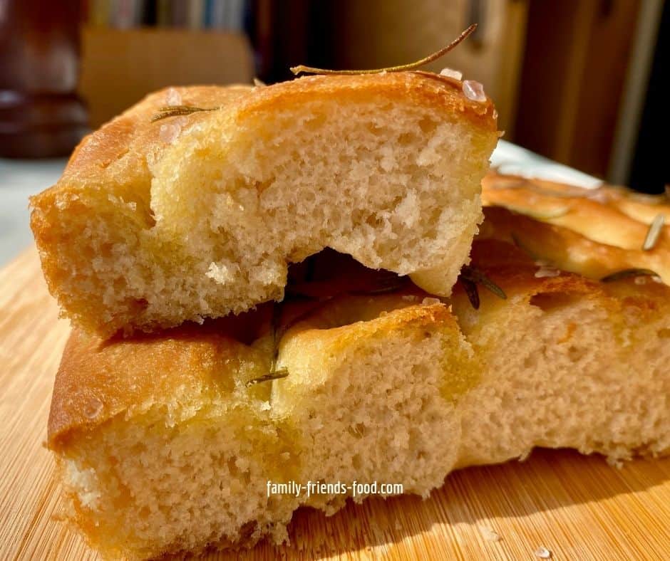 2 pieces of focaccia, stacked one on top of the other.