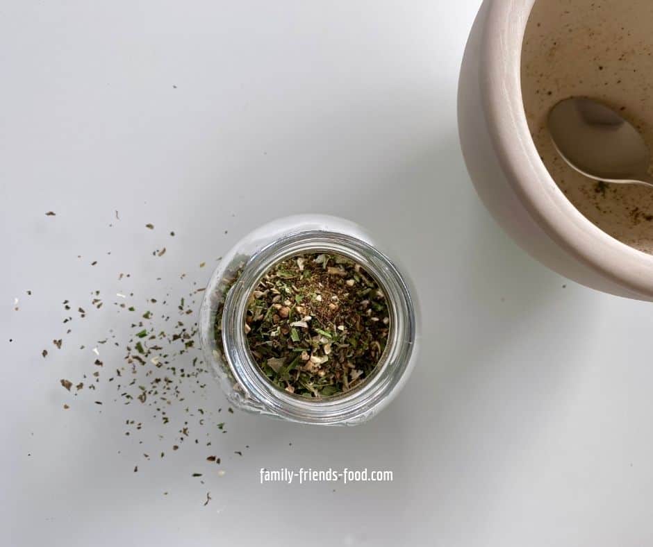 An open jar of 'spice rack' seasoning for salmon, seen from above.